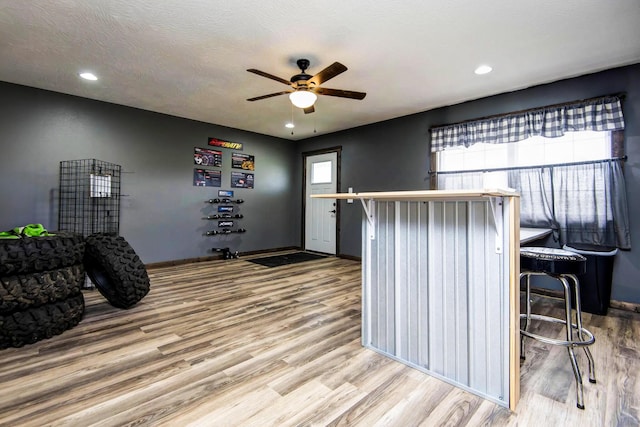 203 E Steel St, Seymour, MO 65746 - kitchen featuring wood finished floors, ceiling fan, baseboards, and recessed lighting