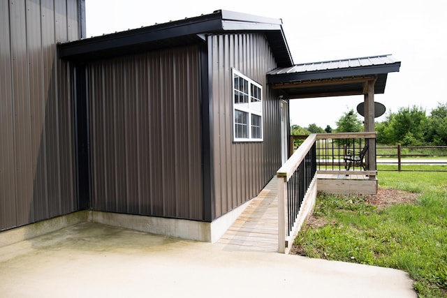 203 E Steel St, Seymour, MO 65746 - view of property exterior with metal roof and a patio area