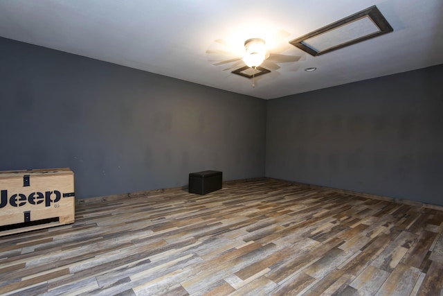 203 E Steel St, Seymour, MO 65746 - empty room featuring attic access, wood finished floors, and ceiling fan