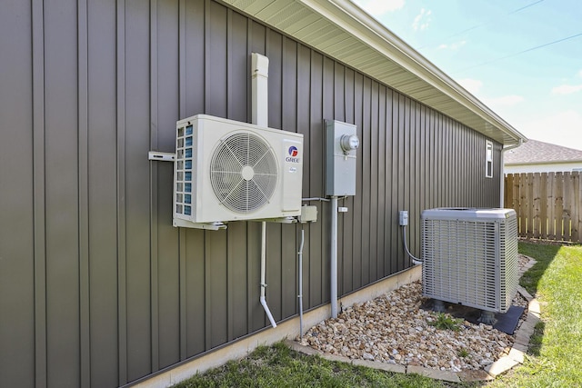 760 W Stewart St, Bolivar, MO 65613 - property entrance with cooling unit, ac unit, fence, and board and batten siding