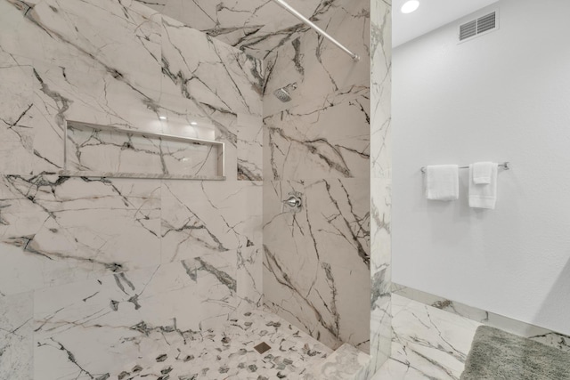 full bathroom with a marble finish shower, visible vents, and recessed lighting