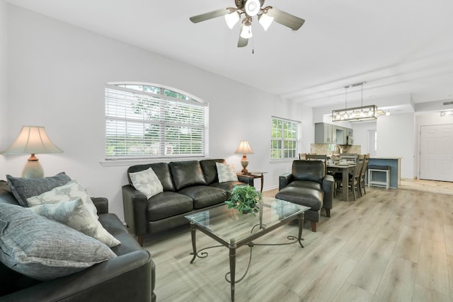 living room featuring ceiling fan and light wood-style floors
