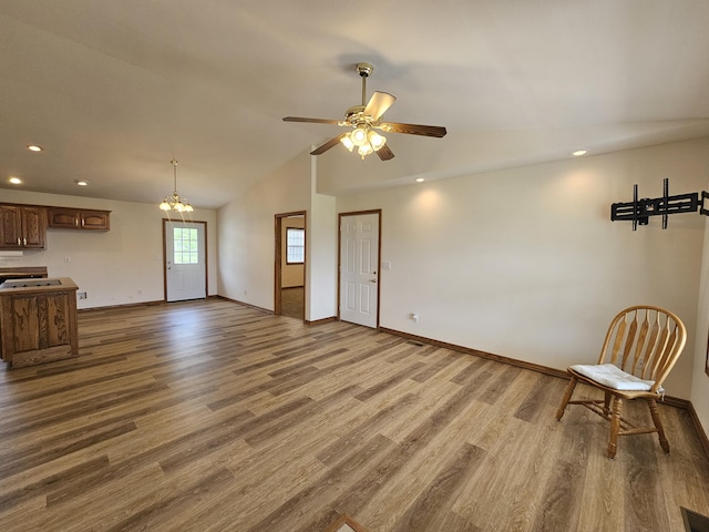 unfurnished living room featuring baseboards and recessed lighting