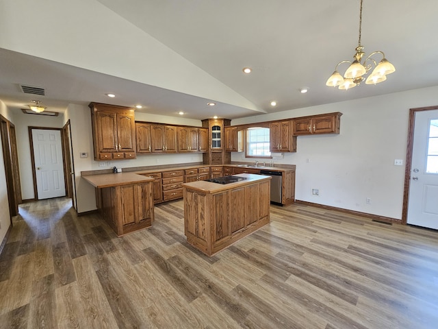 kitchen featuring visible vents, recessed lighting, lofted ceiling, black electric stovetop, and dishwasher