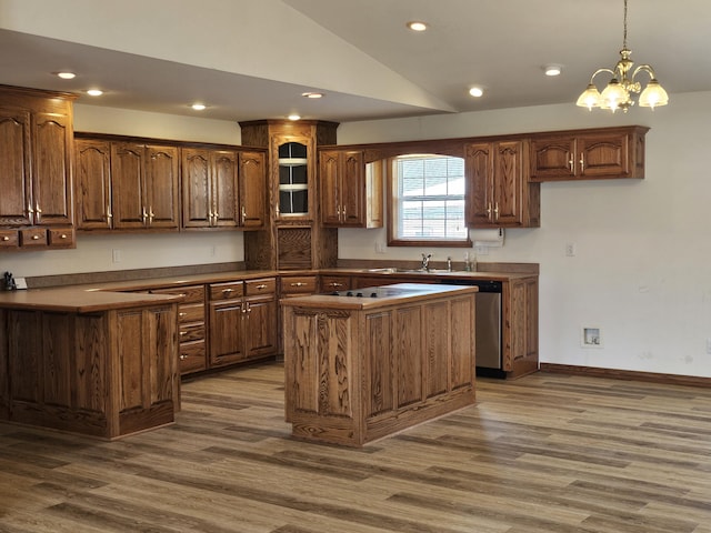 kitchen featuring recessed lighting, dark wood finished floors, lofted ceiling, and dark countertops