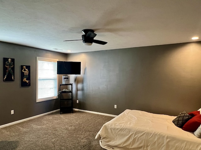 bedroom with carpet flooring, baseboards, and a ceiling fan