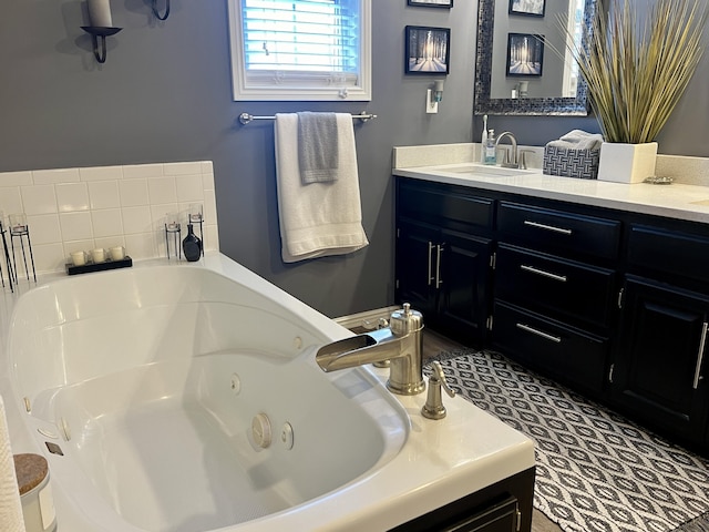 full bathroom featuring vanity and a tub with jets