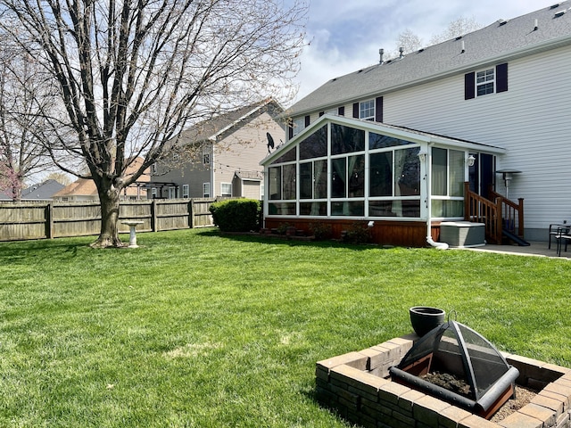view of yard featuring central AC unit, fence, and a sunroom
