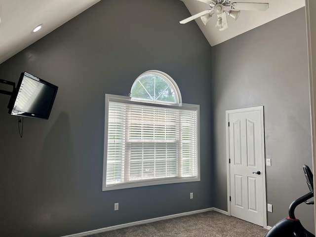 workout room featuring high vaulted ceiling, a ceiling fan, carpet, and baseboards
