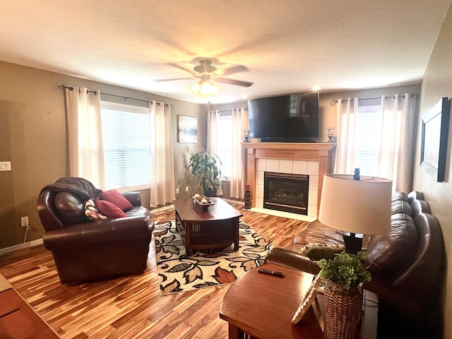 435 E Hadley St, Republic, MO 65738 - living area with a fireplace, wood finished floors, and ceiling fan