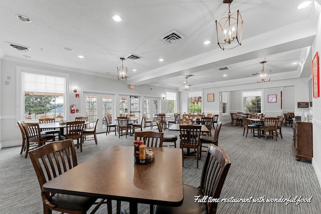 160 The Blfs Unit 3, Branson, MO 65616 - dining area featuring light carpet, a notable chandelier, visible vents, and ornamental molding