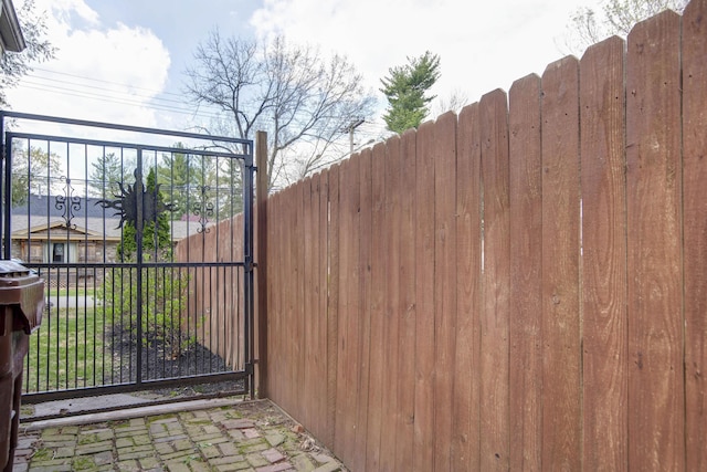 view of gate with fence