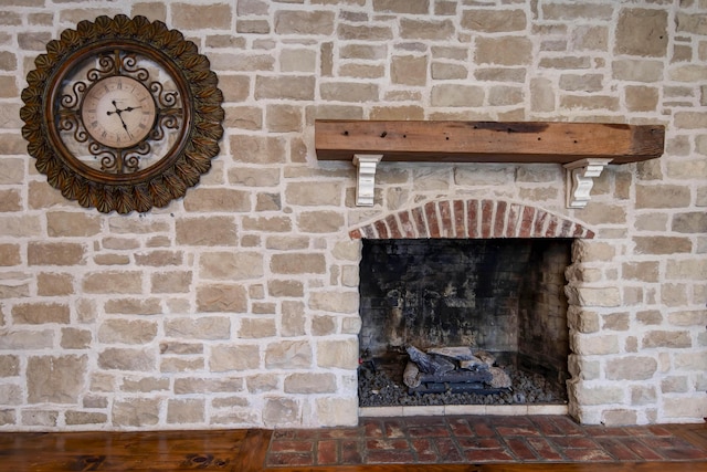 room details featuring a brick fireplace