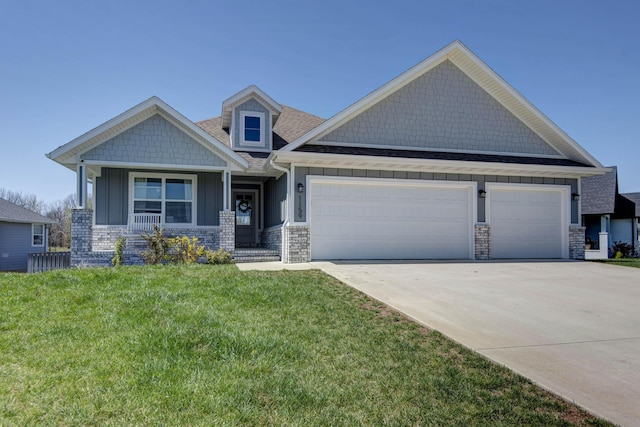 craftsman inspired home featuring a front yard, stone siding, a garage, board and batten siding, and concrete driveway