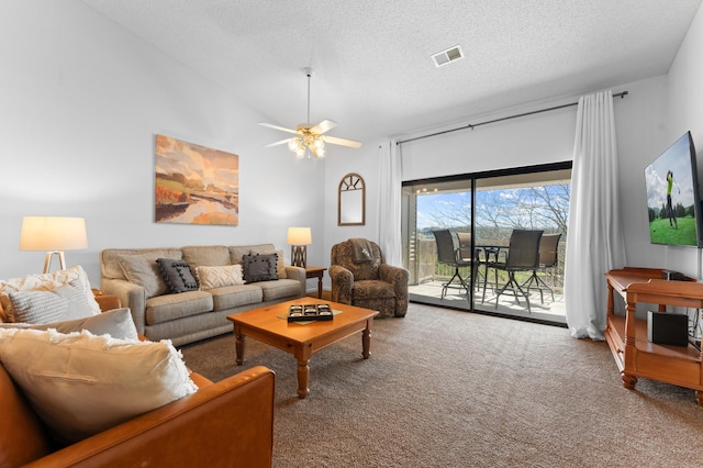 350 S Wildwood Dr Unit 21, Branson, MO 65616 - carpeted living area with a textured ceiling, lofted ceiling, a ceiling fan, and visible vents