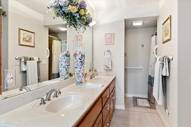 500 Navajo Trl, Kimberling City, MO 65686 - bathroom featuring double vanity, a sink, and baseboards