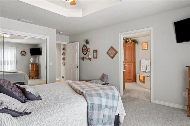 500 Navajo Trl, Kimberling City, MO 65686 - bedroom featuring light carpet, visible vents, a closet, and a raised ceiling