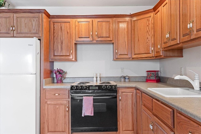 500 Navajo Trl, Kimberling City, MO 65686 - kitchen featuring light countertops, freestanding refrigerator, black electric range, brown cabinets, and a sink