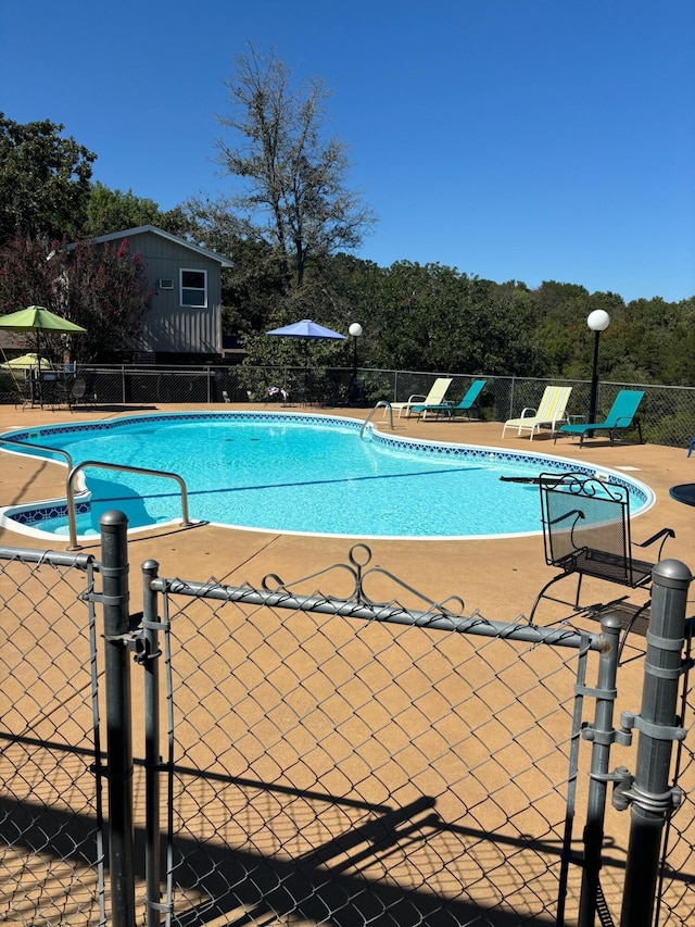500 Navajo Trl, Kimberling City, MO 65686 - community pool with a patio and fence