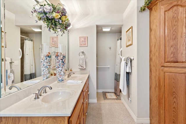 500 Navajo Trl, Kimberling City, MO 65686 - full bath featuring tile patterned floors, double vanity, a sink, and baseboards
