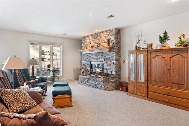 500 Navajo Trl, Kimberling City, MO 65686 - living area featuring visible vents, a stone fireplace, and carpet