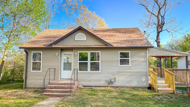 612 E Benton Ave, Ava, MO 65608 - bungalow-style home featuring entry steps, a front lawn, a wooden deck, and a shingled roof
