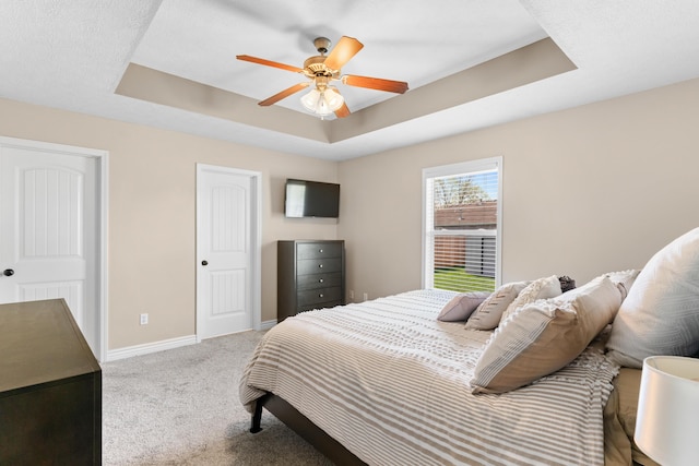 704 E Waterford Blvd, Ozark, MO 65721 - bedroom with a tray ceiling, baseboards, carpet flooring, and ceiling fan