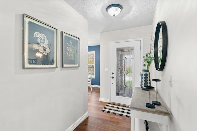 704 E Waterford Blvd, Ozark, MO 65721 - entrance foyer with a textured ceiling, wood finished floors, and baseboards