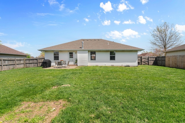 704 E Waterford Blvd, Ozark, MO 65721 - back of property featuring a patio, a fenced backyard, and a lawn