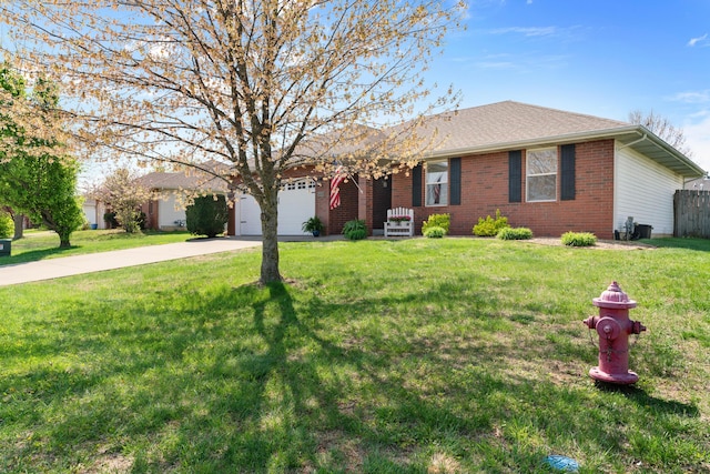 704 E Waterford Blvd, Ozark, MO 65721 - ranch-style house featuring a garage, a front yard, brick siding, and driveway