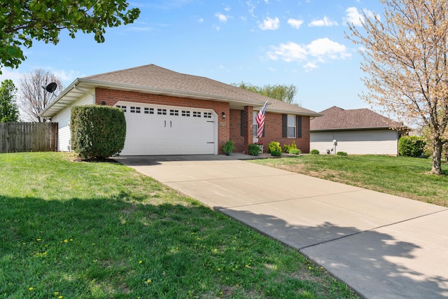 704 E Waterford Blvd, Ozark, MO 65721 - single story home featuring brick siding, a front lawn, a garage, and concrete driveway