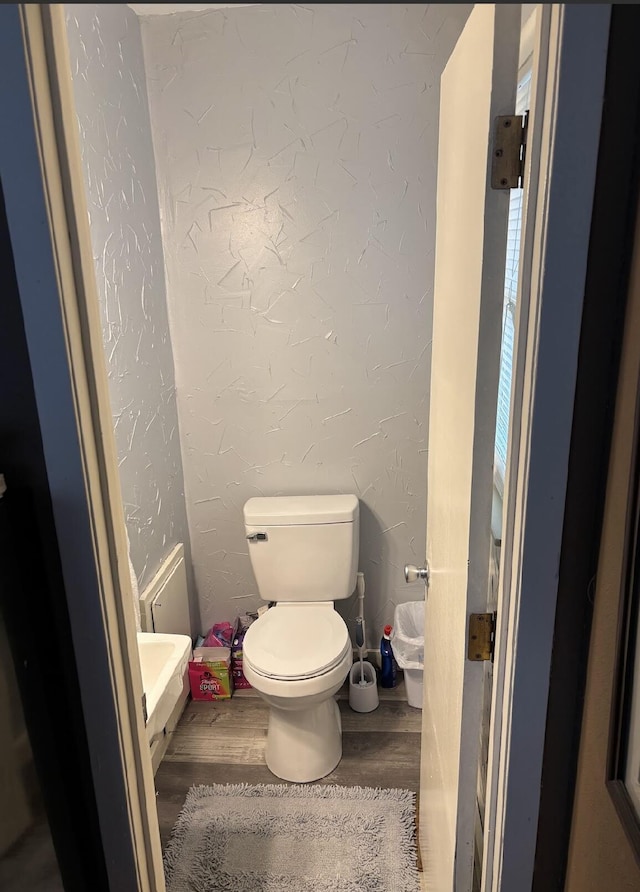 85 Peggy Ave, Mammoth Spring, AR 72554 - bathroom with wood finished floors and a textured wall