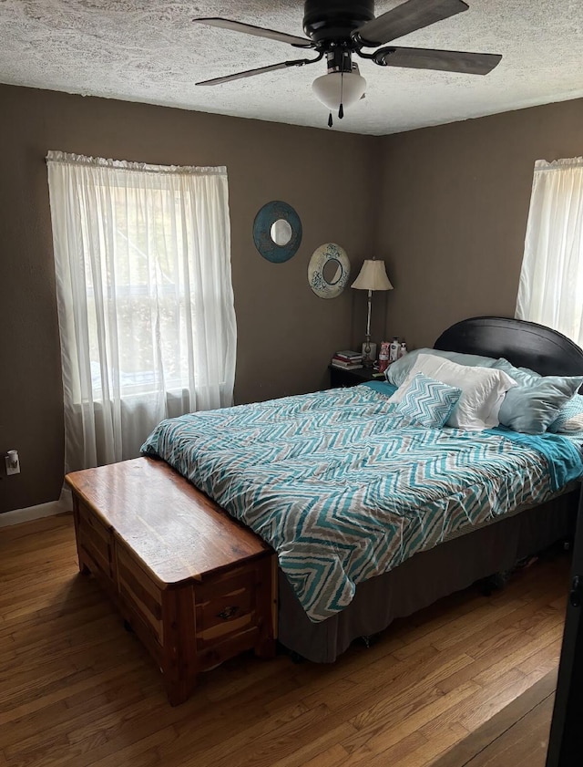 85 Peggy Ave, Mammoth Spring, AR 72554 - bedroom with wood finished floors, a textured ceiling, and ceiling fan
