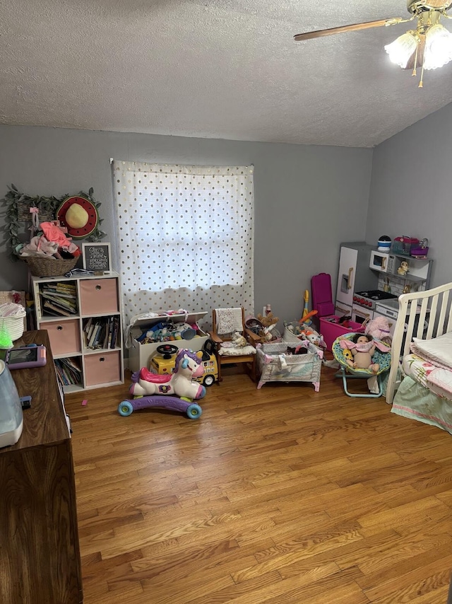 85 Peggy Ave, Mammoth Spring, AR 72554 - bedroom featuring light wood-style flooring, a textured ceiling, and ceiling fan