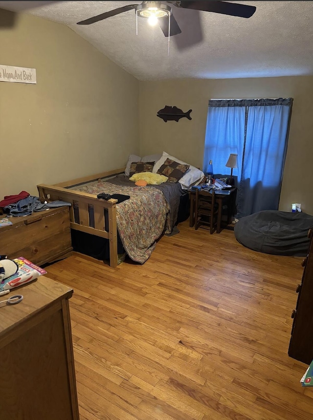85 Peggy Ave, Mammoth Spring, AR 72554 - bedroom featuring light wood finished floors, a textured ceiling, ceiling fan, and vaulted ceiling