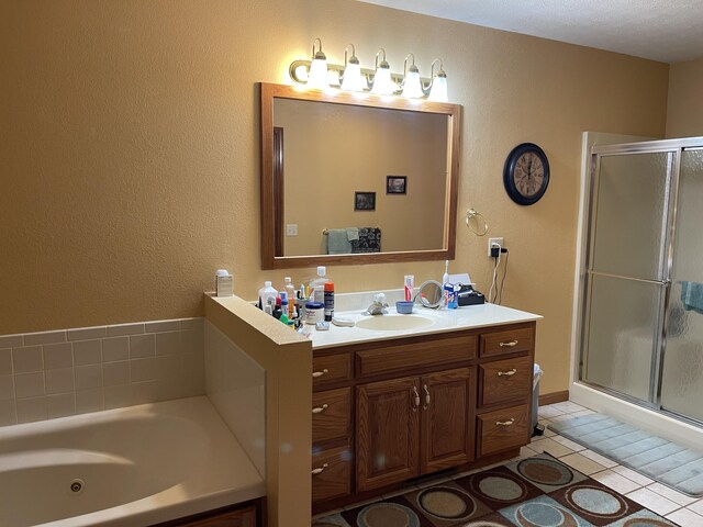 1605 S Meadow Ln, Bolivar, MO 65613 - full bathroom with tile patterned floors, vanity, a tub with jets, and a stall shower