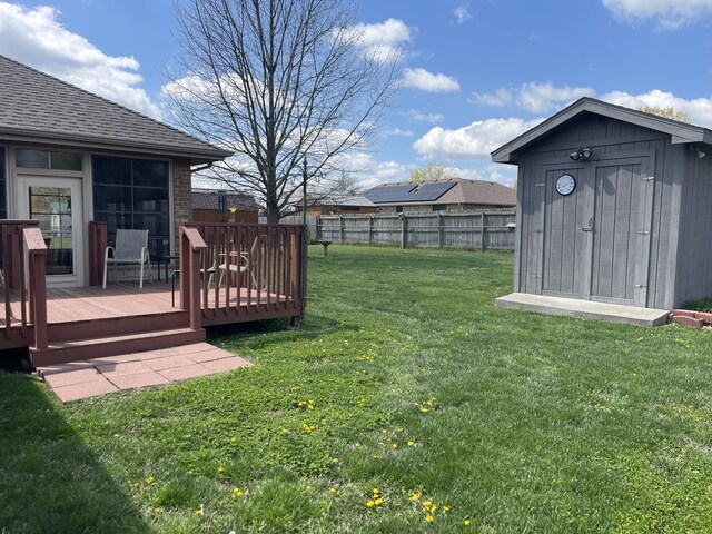 1605 S Meadow Ln, Bolivar, MO 65613 - view of yard with a storage shed, a fenced backyard, a wooden deck, and an outdoor structure