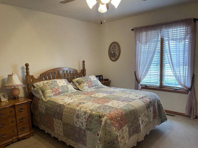 1605 S Meadow Ln, Bolivar, MO 65613 - bedroom with visible vents, ceiling fan, light carpet, and baseboards