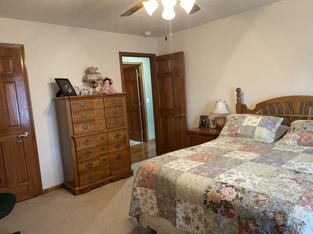 1605 S Meadow Ln, Bolivar, MO 65613 - bedroom featuring light carpet, baseboards, and a ceiling fan