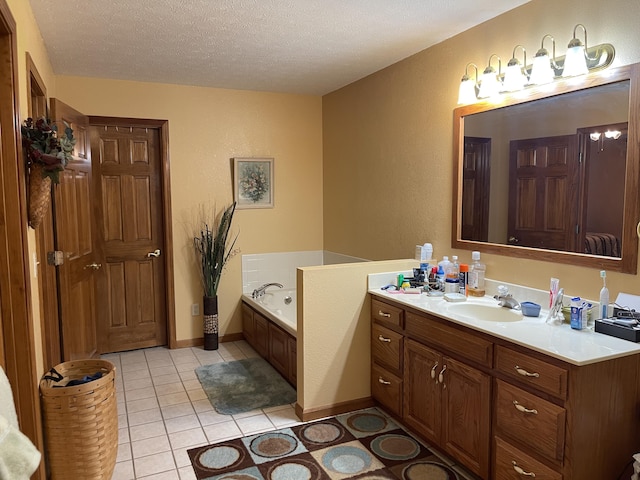 1605 S Meadow Ln, Bolivar, MO 65613 - full bath with a textured wall, a textured ceiling, vanity, tile patterned floors, and a garden tub
