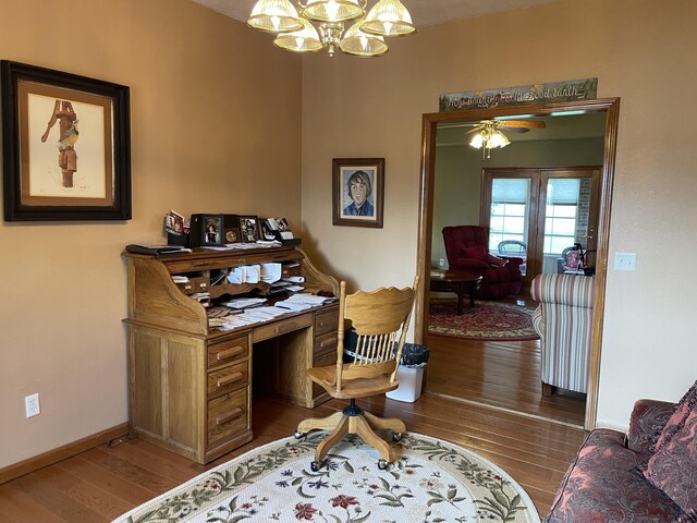 1605 S Meadow Ln, Bolivar, MO 65613 - office space featuring baseboards, hardwood / wood-style floors, and ceiling fan with notable chandelier