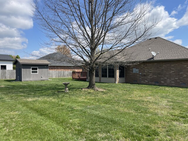 1605 S Meadow Ln, Bolivar, MO 65613 - view of yard with a sunroom, an outdoor structure, fence, and a storage unit