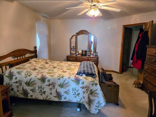 carpeted bedroom featuring a ceiling fan