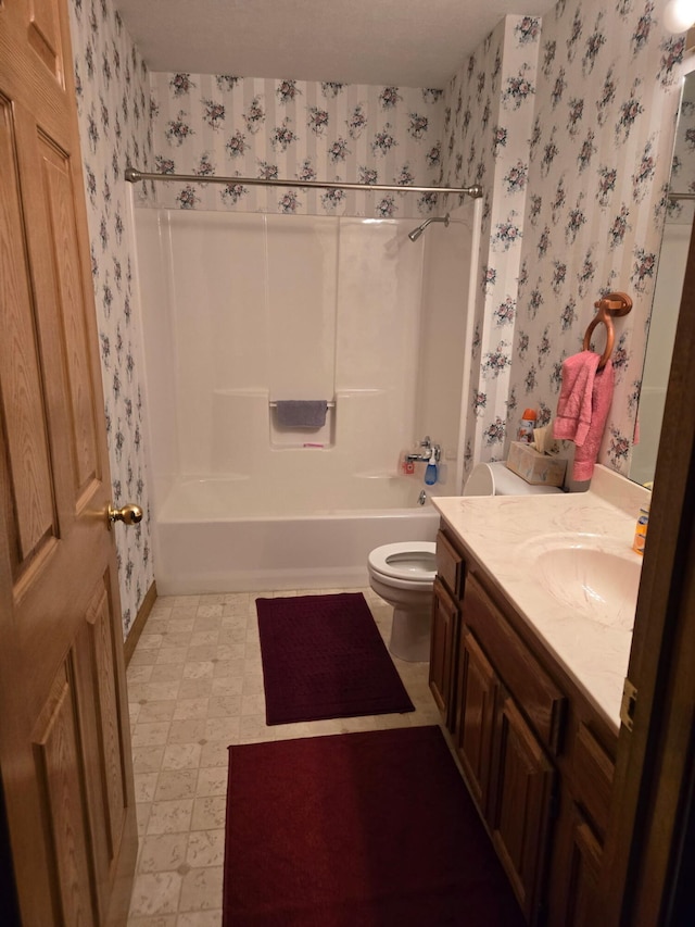 full bathroom with tub / shower combination, vanity, toilet, tile patterned floors, and wallpapered walls