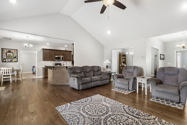 1758 W Big Meadows Ln, Nixa, MO 65714 - living room featuring ceiling fan with notable chandelier, high vaulted ceiling, dark wood finished floors, visible vents, and recessed lighting