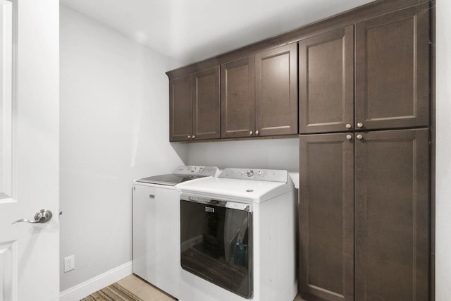 1758 W Big Meadows Ln, Nixa, MO 65714 - clothes washing area featuring cabinet space, independent washer and dryer, and baseboards