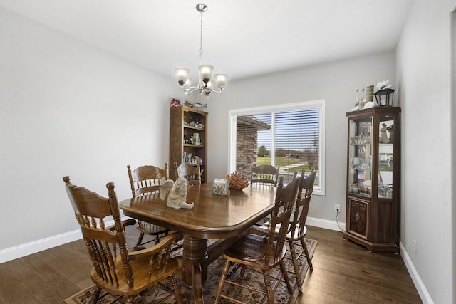 1758 W Big Meadows Ln, Nixa, MO 65714 - dining space featuring dark wood-type flooring, baseboards, and a chandelier