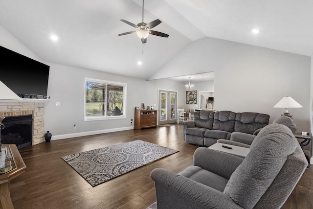 1758 W Big Meadows Ln, Nixa, MO 65714 - living area with wood finished floors, a fireplace, and ceiling fan with notable chandelier