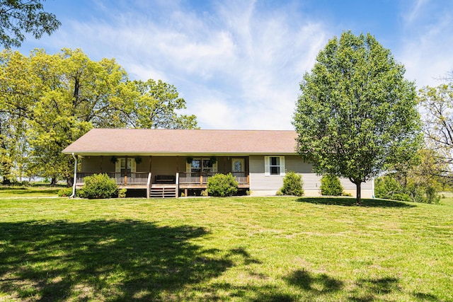 ranch-style home featuring a front yard