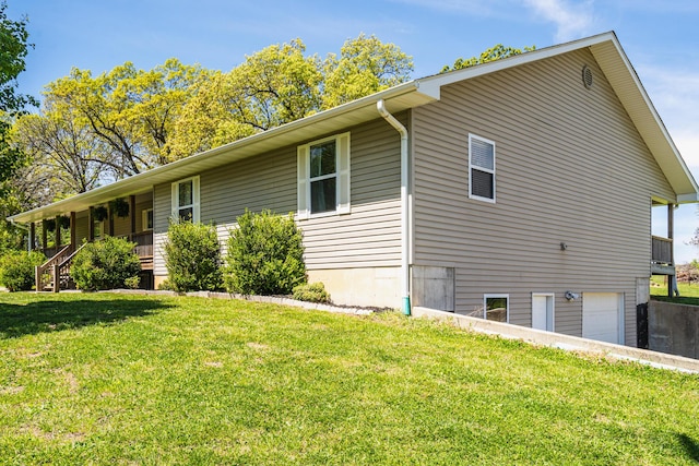view of property exterior with a lawn and a garage
